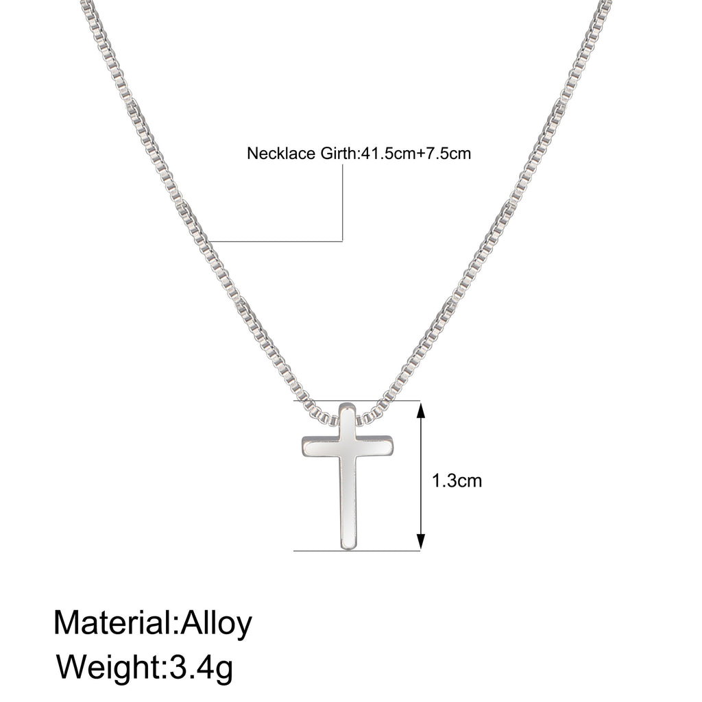 Silver necklace with cross pendant on a white background, showing measurements and material details.