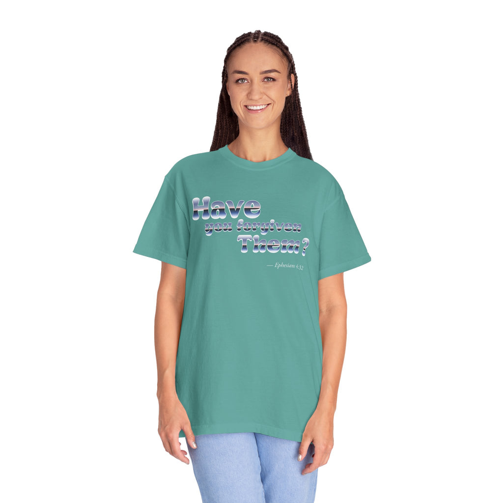 Person wearing a teal t-shirt with text on a white background