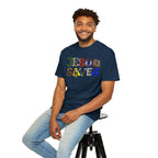 Man wearing a navy blue t-shirt with 'Jesus Saves' text, sitting on a stool against a white background
