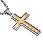 Gold and silver cross pendant with engraved text on a white background