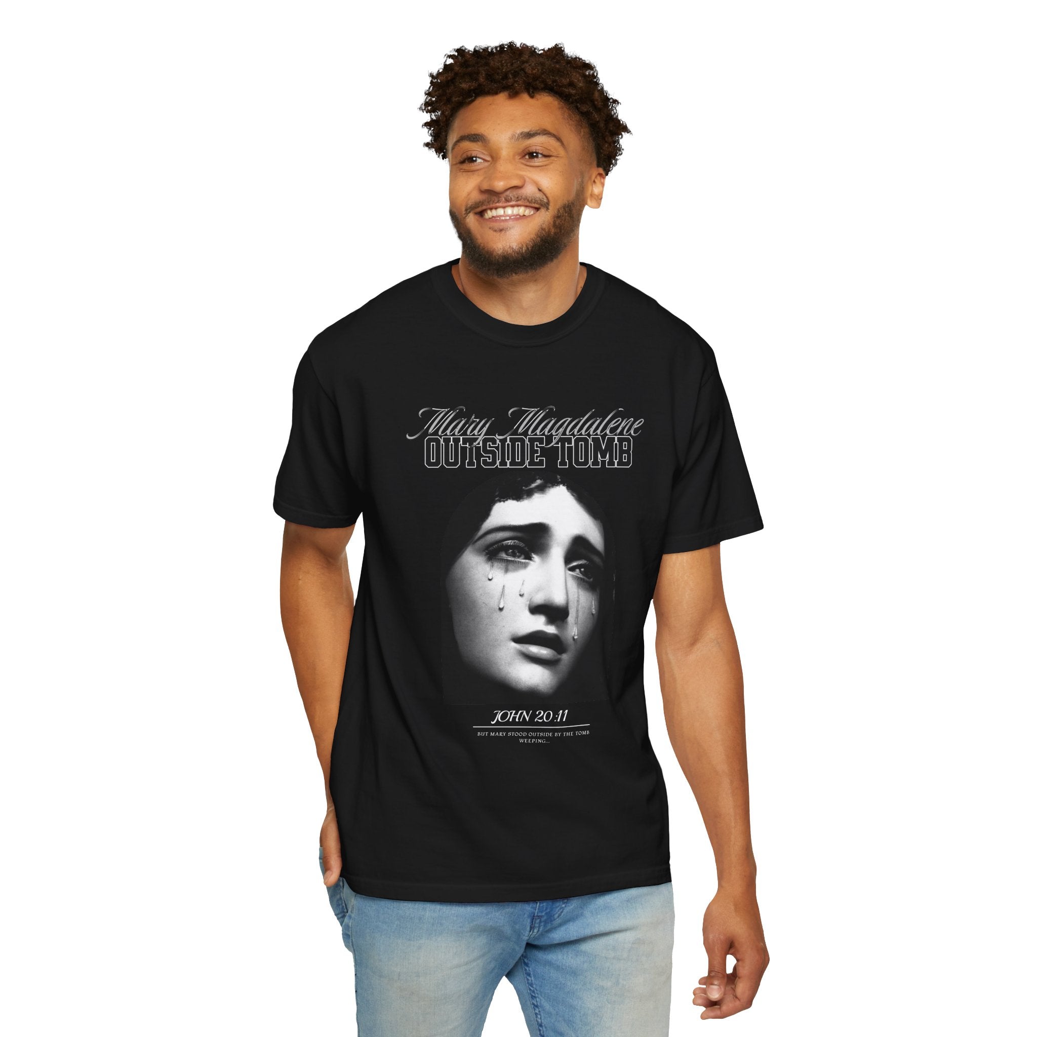 Person wearing a black t-shirt with a graphic design and text on a white background