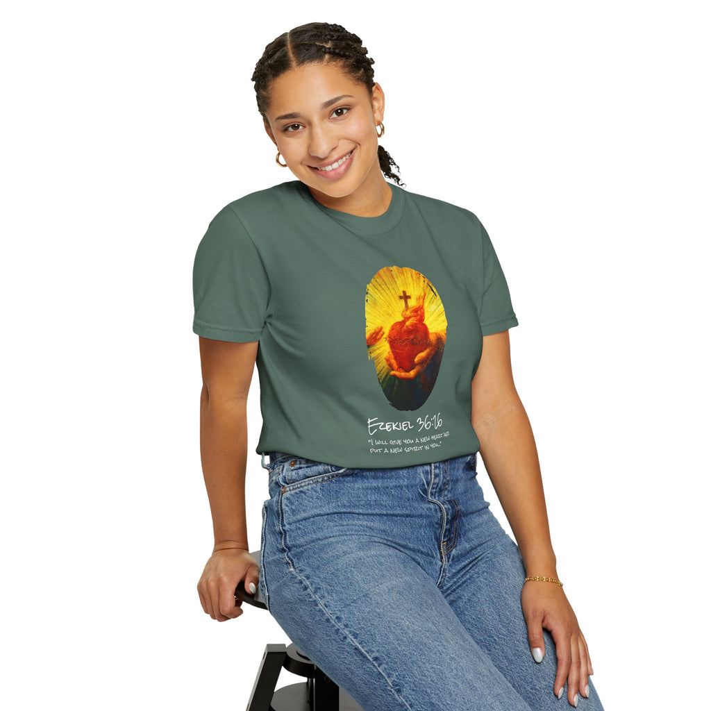 Person wearing a green t-shirt with a graphic design on a white background