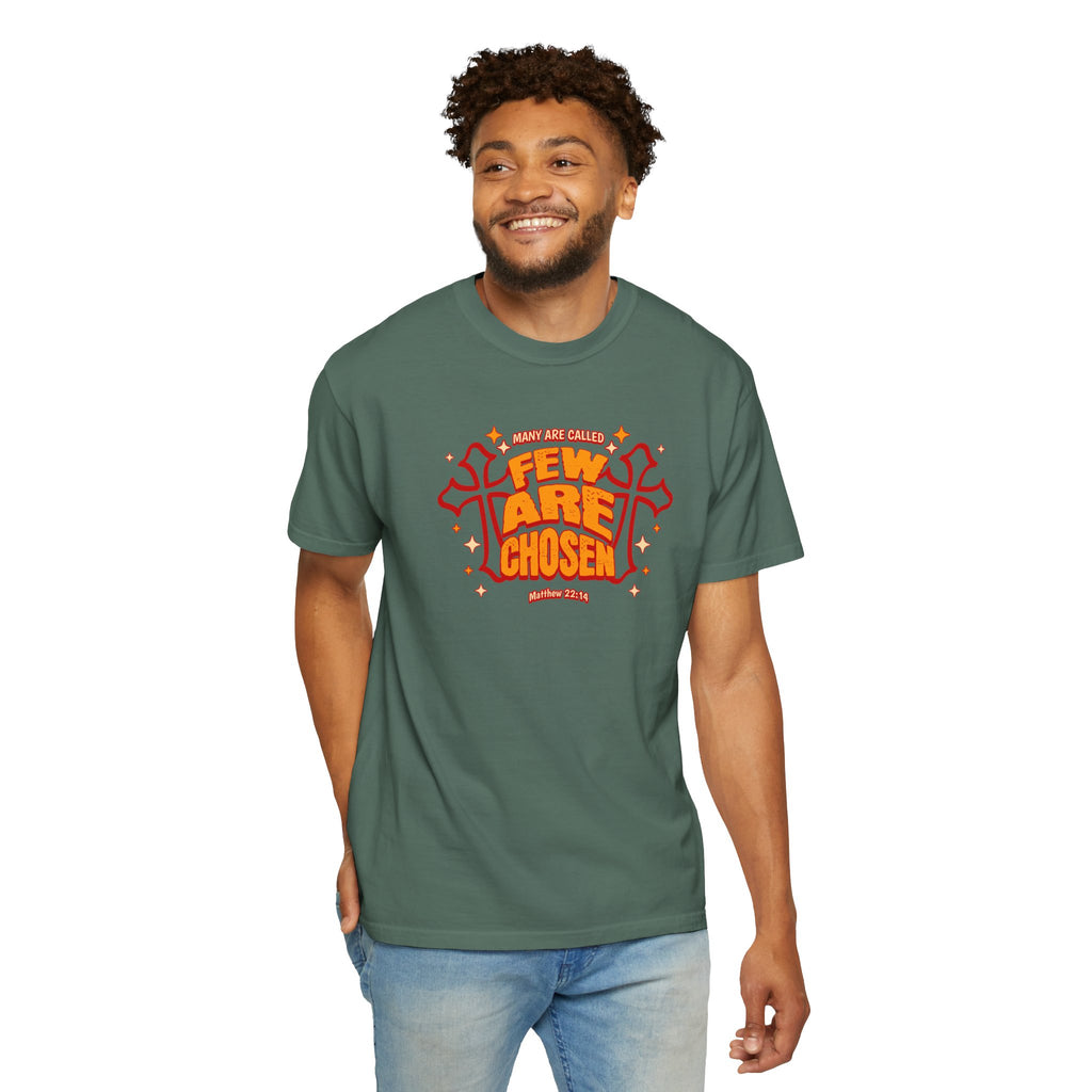 Man wearing a green t-shirt with red and white text on a white background