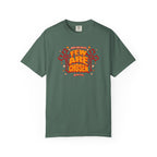 Green t-shirt with red and white text and graphics on a white background