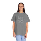 Woman wearing a gray t-shirt with text and a cross graphic on a white background