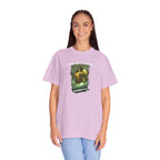 Person wearing a purple t-shirt with a graphic design on a white background
