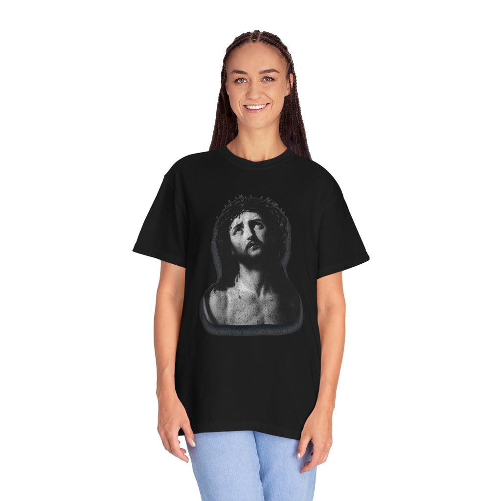 Person wearing a black t-shirt with a graphic design on a white background