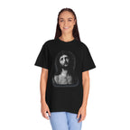Person wearing a black t-shirt with a graphic design on a white background