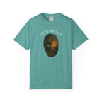 Teal t-shirt with a graphic design and 'Genesis 3:15' text on a white background