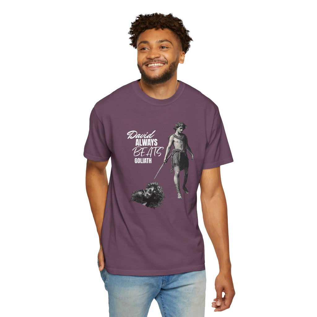 Man wearing a purple t-shirt with a graphic design and text on a white background