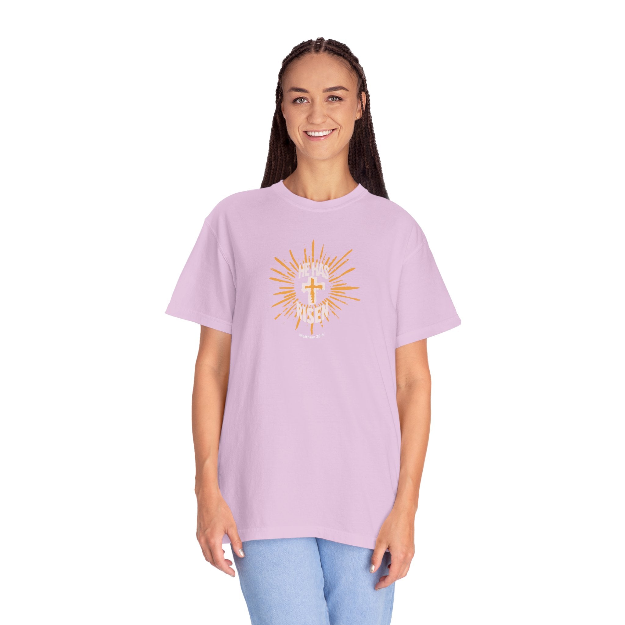 Person wearing a light purple t-shirt with a colorful design on a white background