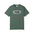 Green t-shirt with a crown of thorns and 'Come Wit' text on a white background