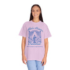 Woman wearing a light purple t-shirt with a graphic design and text on a white background