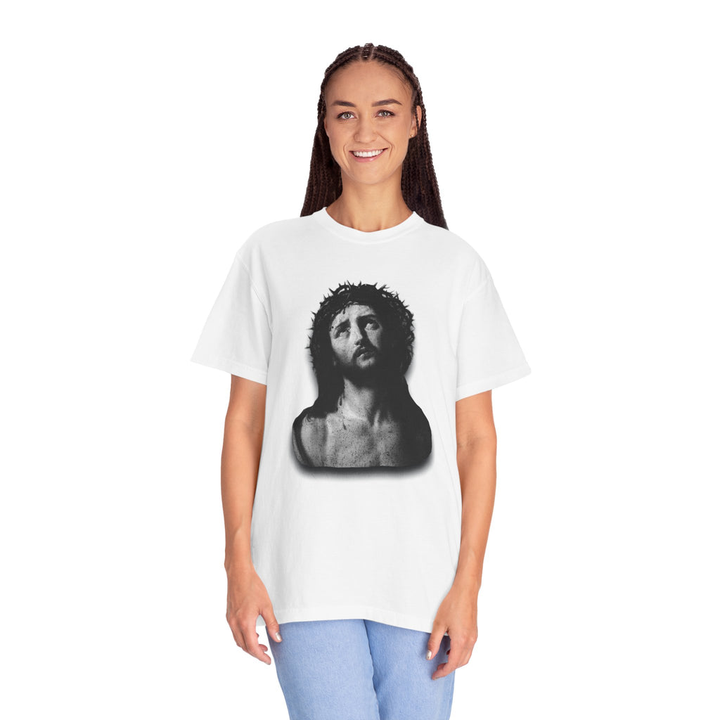 Person wearing a white t-shirt with a graphic design on a white background