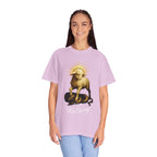 Person wearing a light purple t-shirt with a graphic design on a white background