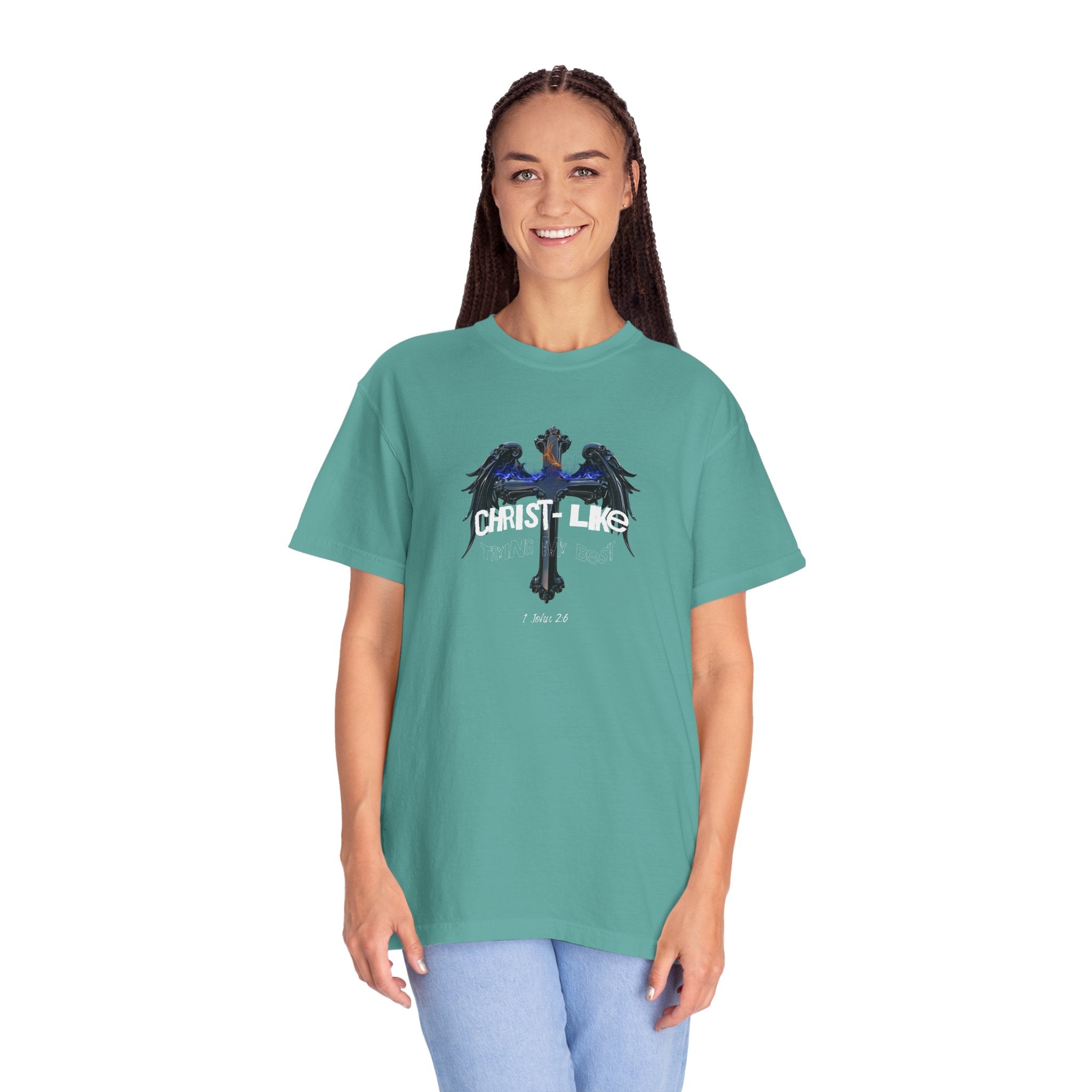 Person wearing a teal t-shirt with a graphic design on a white background