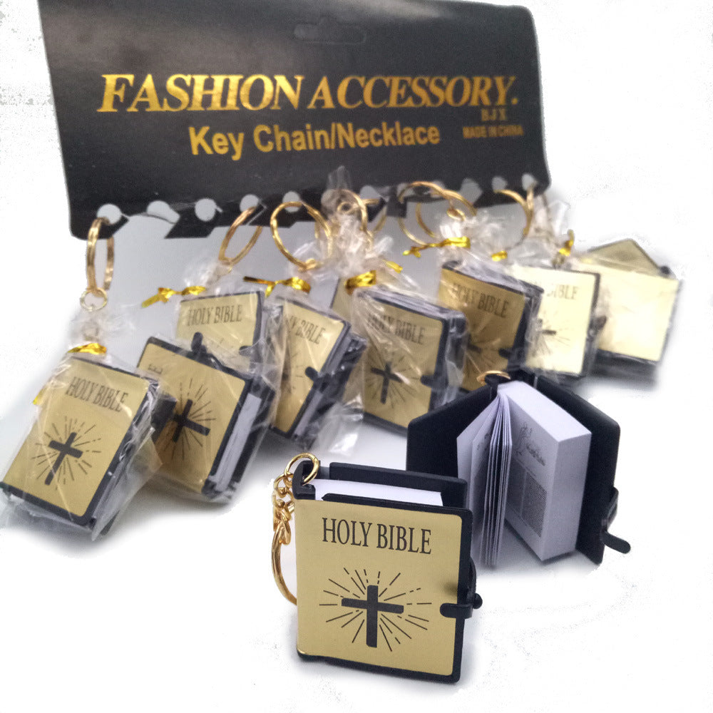 Holy Bible keychains with packaging on a white background