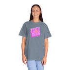 Person wearing a gray t-shirt with pink and yellow text on a white background