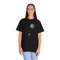Person wearing a black t-shirt with a graphic design on a white background