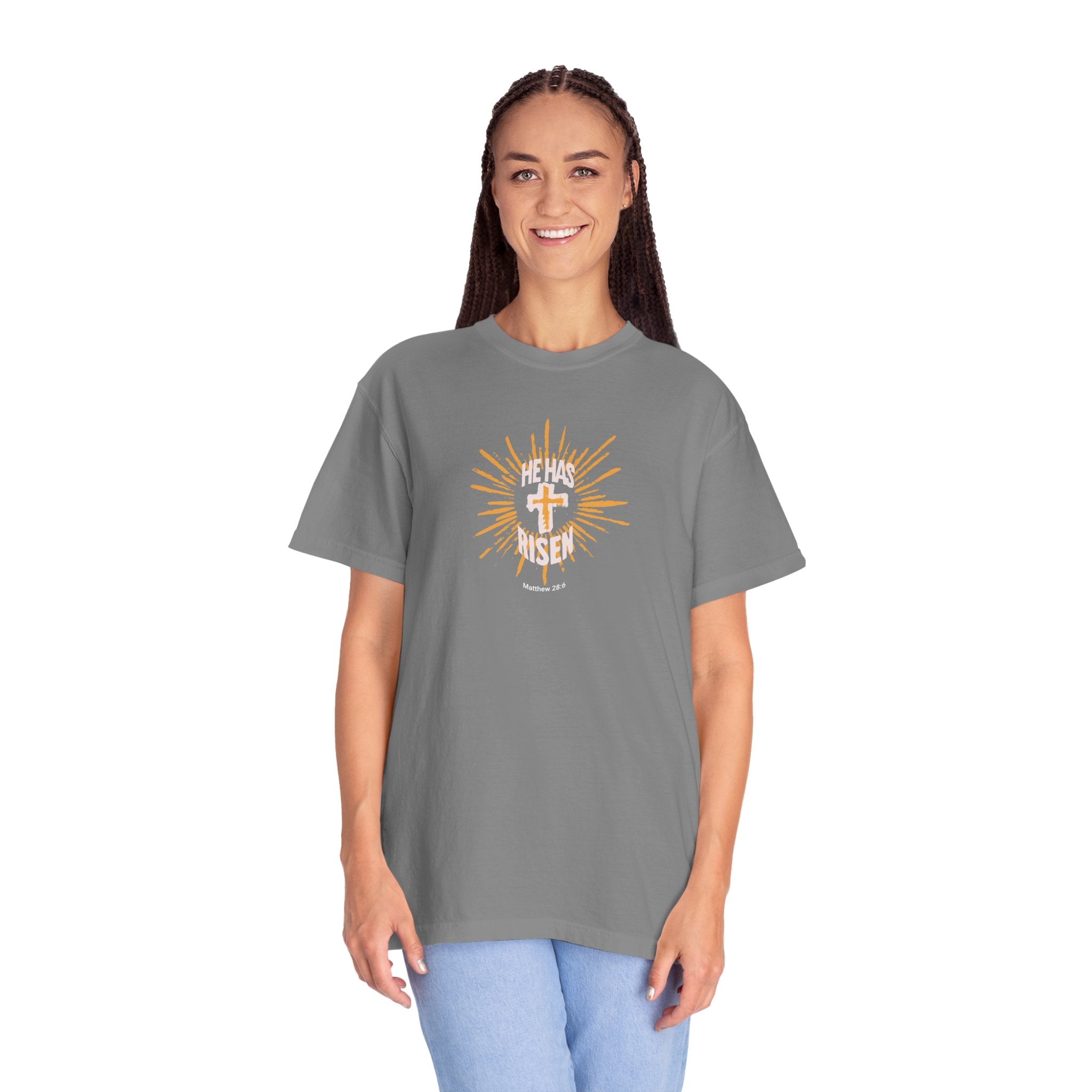 Woman wearing a gray t-shirt with a graphic design on a white background