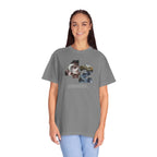 Person wearing a gray t-shirt with a graphic design on a white background