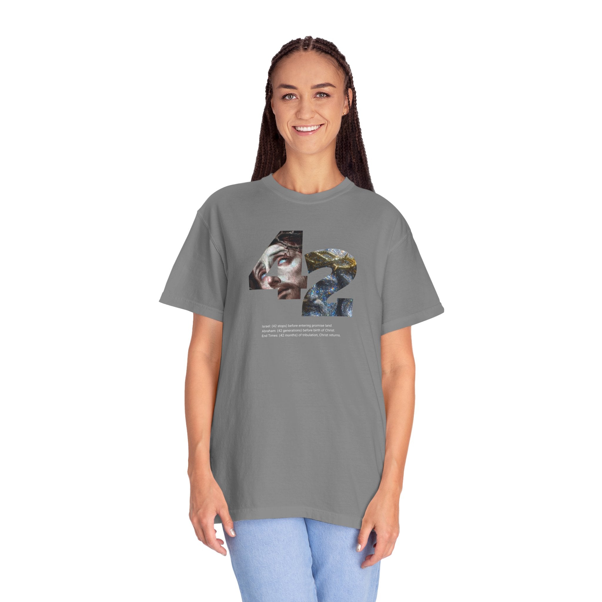 Person wearing a gray t-shirt with a graphic design on a white background