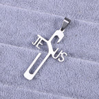 Silver cross-shaped pendant with 'Jesus' on a gray textured background
