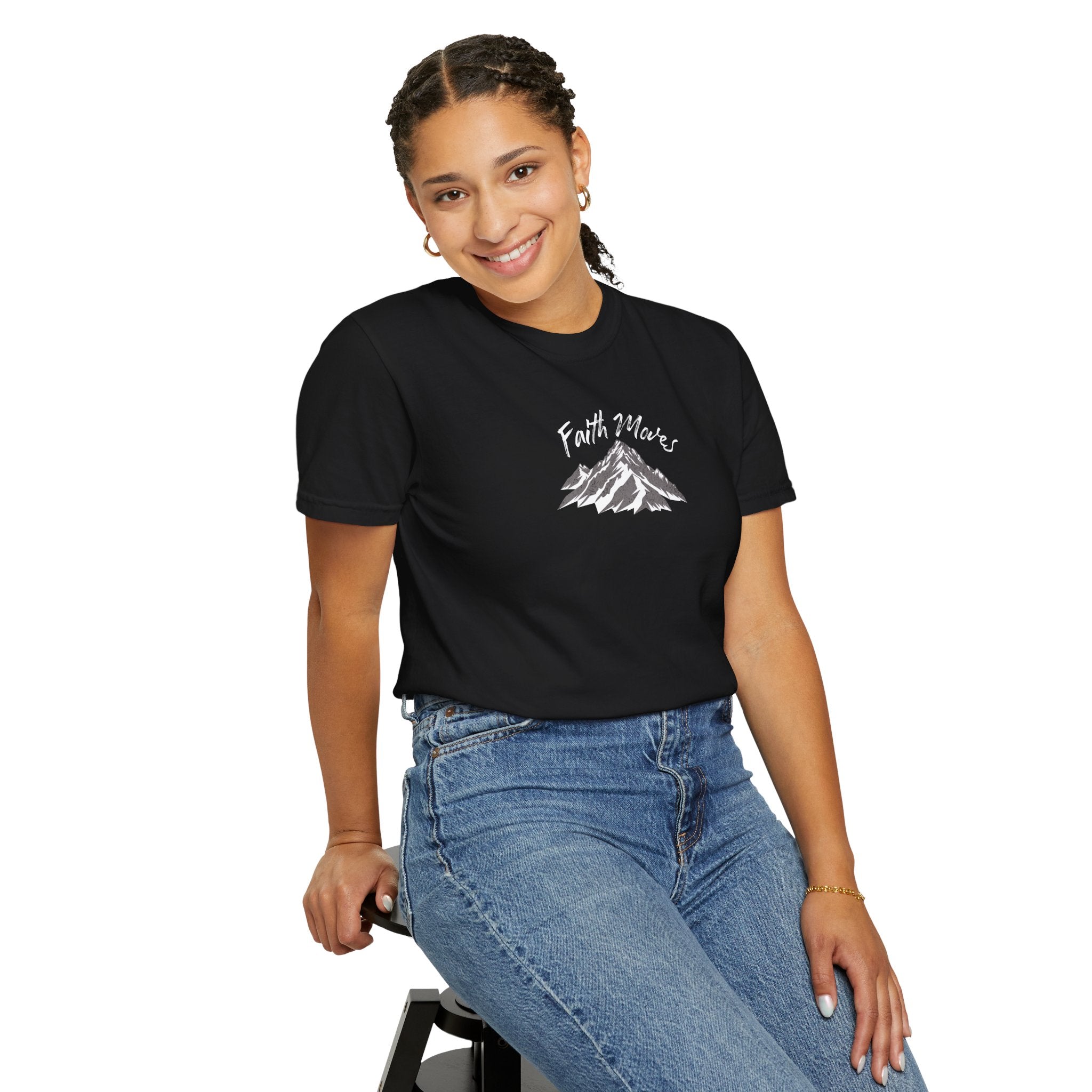 Person wearing a black t-shirt with a graphic design on a white background