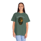 Woman wearing a green t-shirt with a graphic and text on a white background