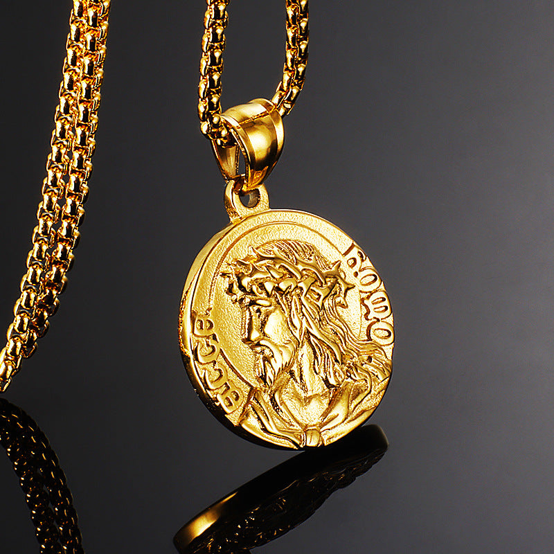 Gold necklace with a lion head pendant on a dark background
