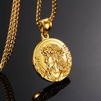 Gold necklace with a lion head pendant on a dark background
