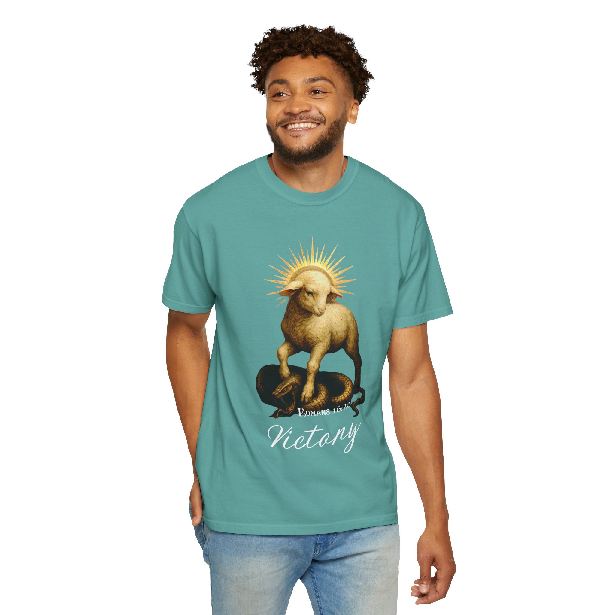 Man wearing a teal t-shirt with a graphic design on a white background