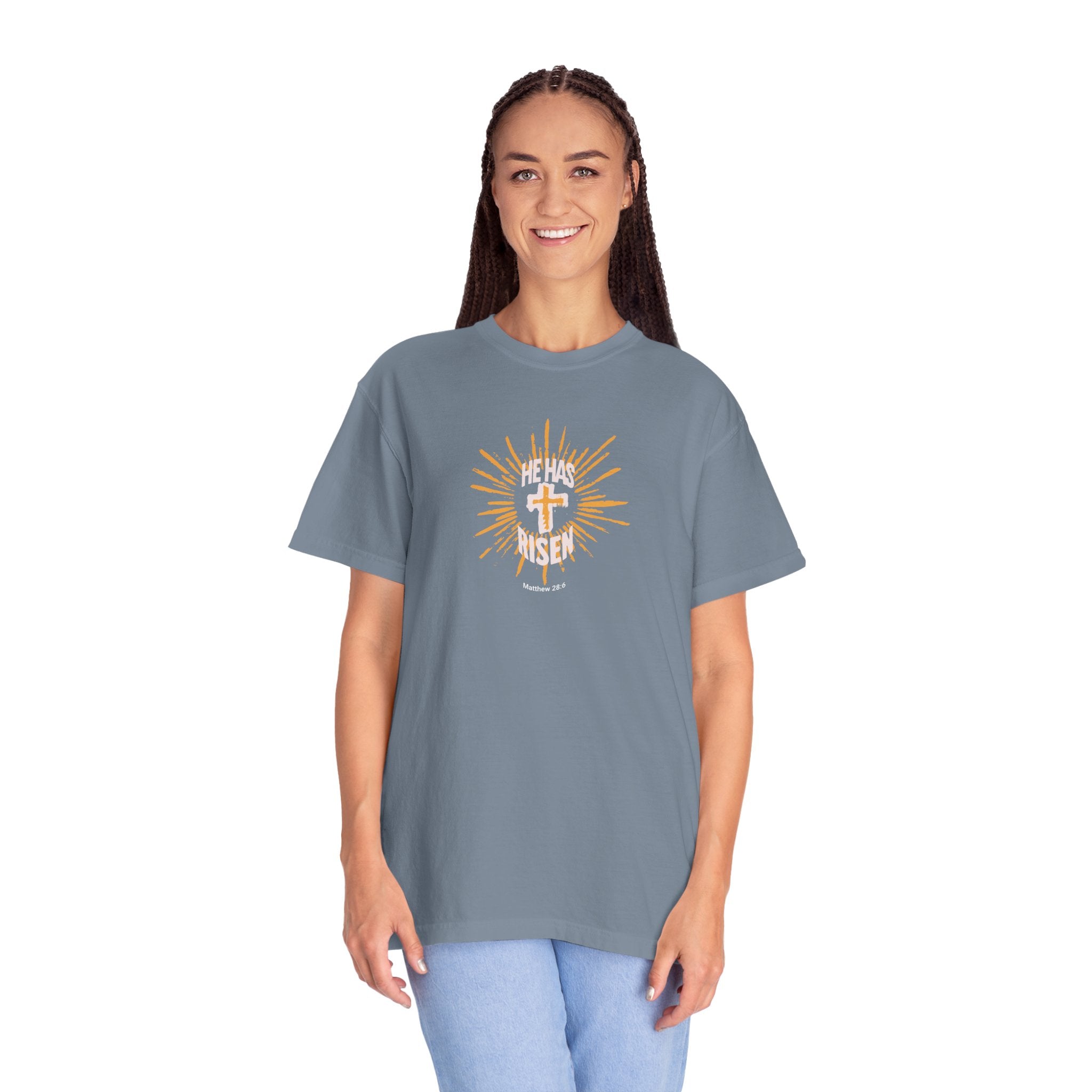 Woman wearing a blue t-shirt with a graphic design on a white background