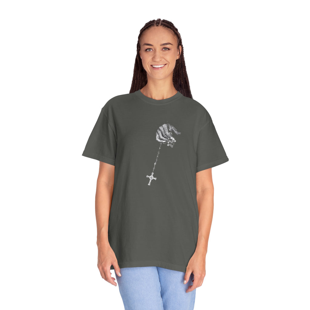 Person wearing a dark gray t-shirt with a graphic design on a white background