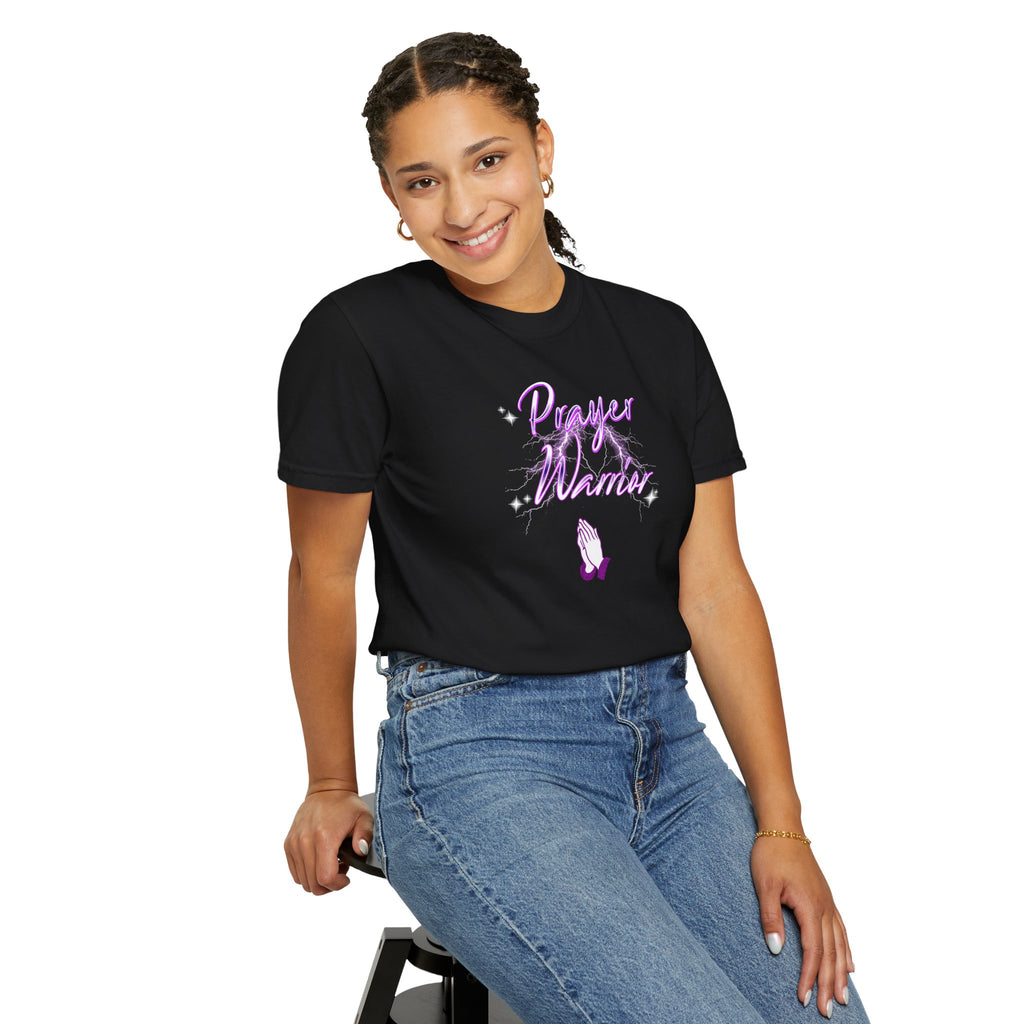 Person wearing a black t-shirt with 'Power Women' text and purple design, sitting on a stool against a white background.
