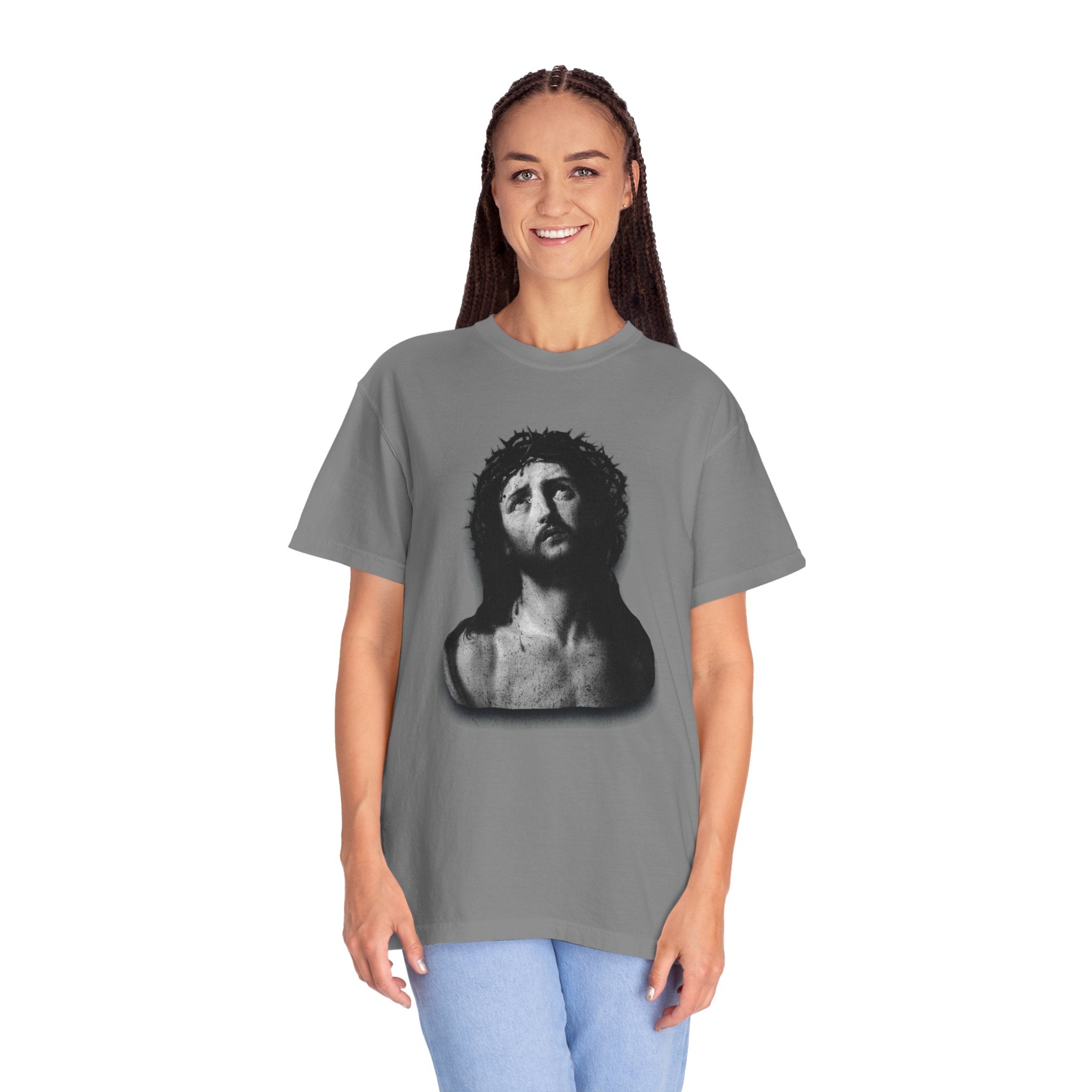 Person wearing a gray t-shirt with a graphic design on a white background