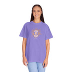 Woman wearing a purple t-shirt with a graphic design on a white background