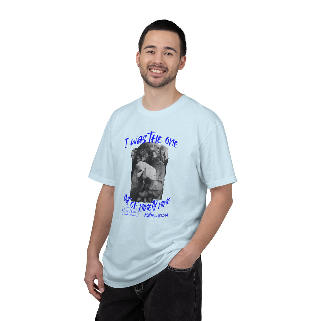 Man wearing a light blue t-shirt with a graphic and text on a white background