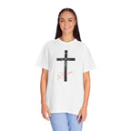 Person wearing a white t-shirt with a black cross and red text on a white background