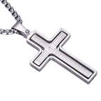 Silver cross pendant with engraved text on a white background