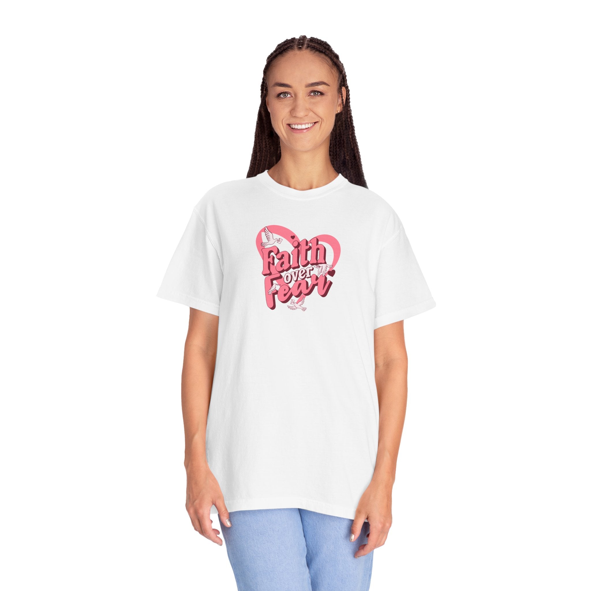Person wearing a white t-shirt with 'Faith Over Fear' text and pink heart design on a white background