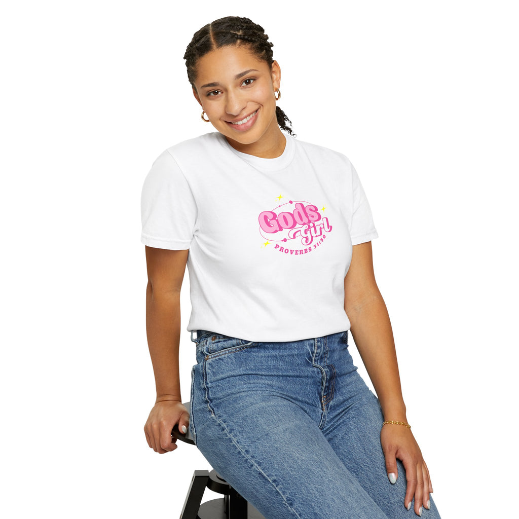 Person wearing a white t-shirt with 'Gods Girl' text, sitting on a stool against a white background
