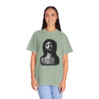 Person wearing a green t-shirt with a graphic design on a white background
