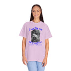 Person wearing a light purple t-shirt with graphic design and text on a white background