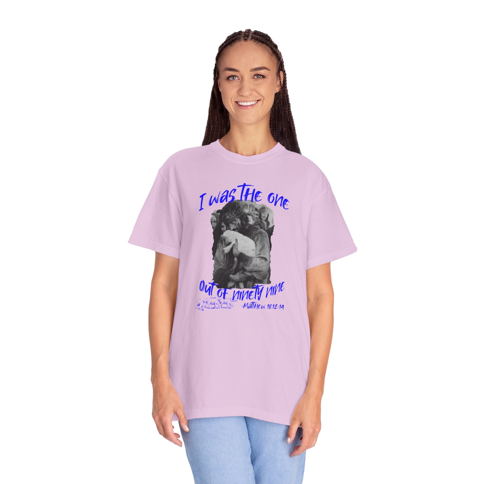 Person wearing a light purple t-shirt with graphic design and text on a white background
