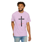 Man wearing a light purple t-shirt with a black cross and red text on a white background