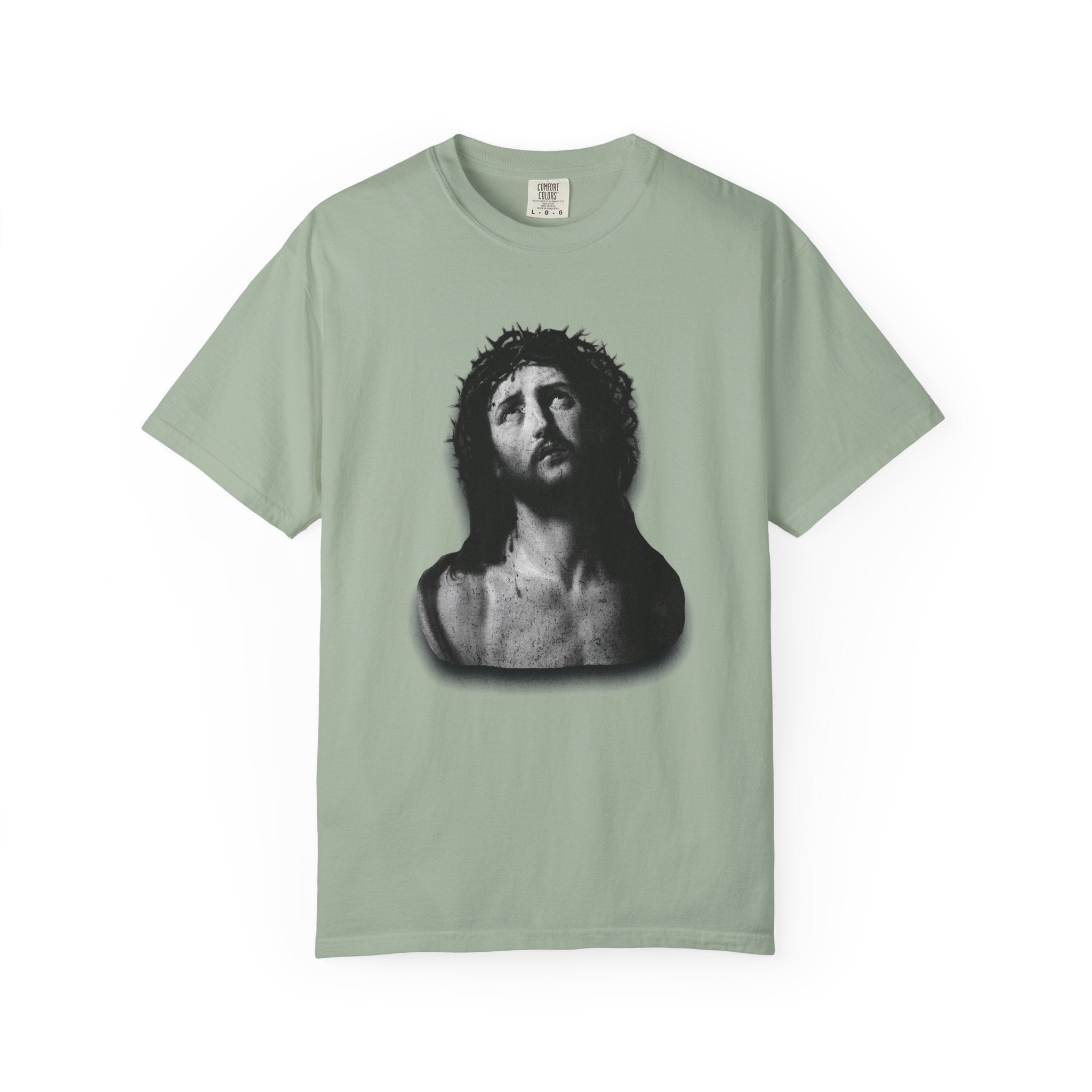 Light green t-shirt with a black and white graphic of a man's head on a white background
