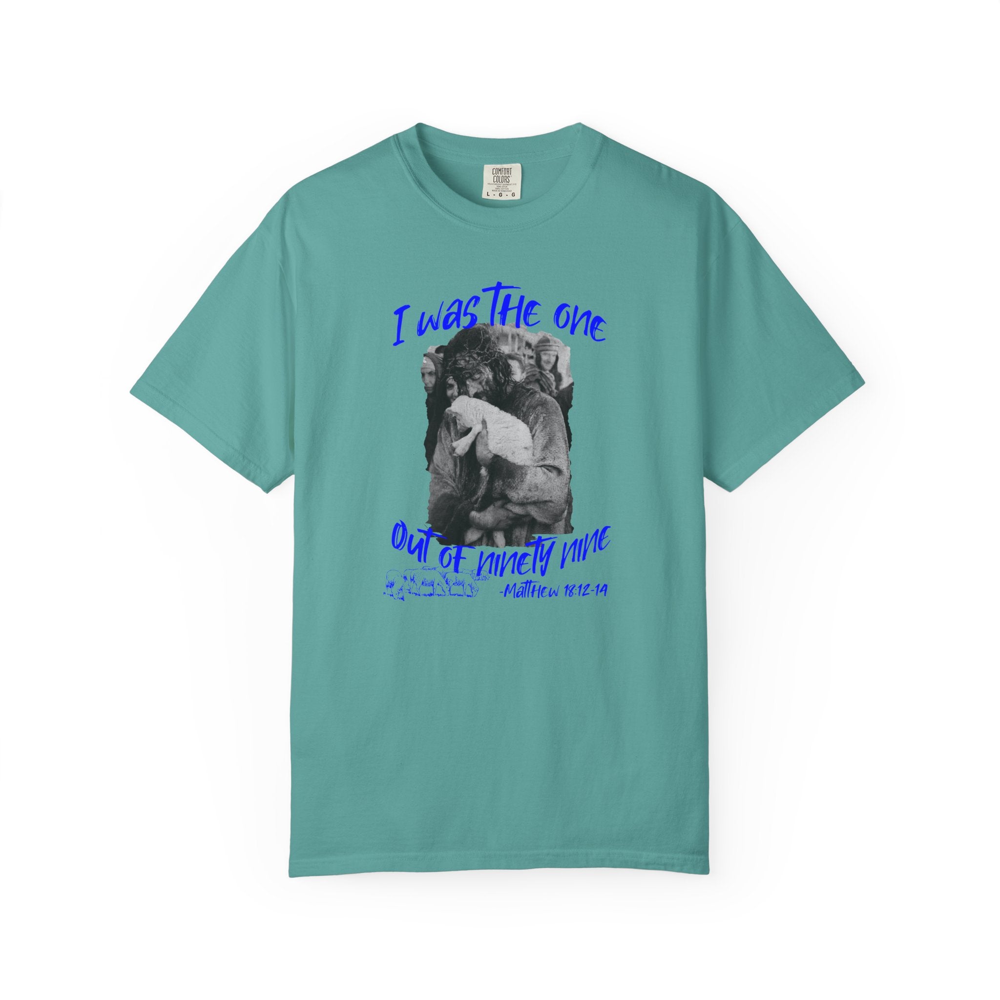 Teal t-shirt with graphic design and text on a white background