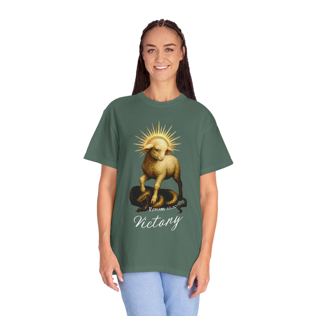 Person wearing a green t-shirt with a graphic design on a white background