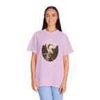 Person wearing a light purple t-shirt with a graphic design on a white background